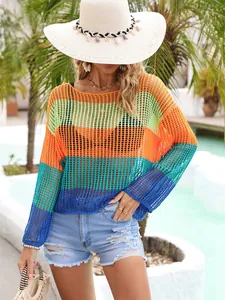 Close-up of vibrant rainbow striped hollow-out knit beach cover up for vacation