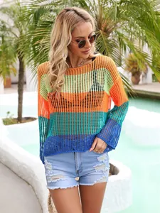 Detailed view of a rainbow striped hollow out crochet knit cover up for summer beachwear