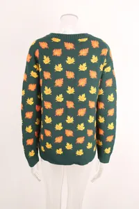 Back view of a green knit sweater with orange and yellow maple leaf pattern detail