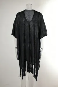 Detailed view of the black crochet hollow beach cover-up with fringe tassels