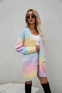Close-up view of a stylish women's oversized rainbow tie-dye knitted cardigan.