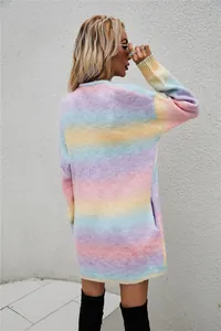 Stylish back view of a woman wearing a rainbow tie-dye long loose knit cardigan sweater.