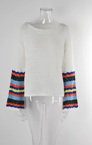 Women's white crochet beach cover-up featuring vibrant colorful striped flare sleeves