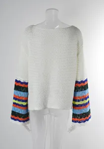 Back view of white hollow-out knit beach cover-up featuring colorful striped crochet sleeves
