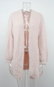 Detail view of pink herringbone fuzzy knit cardigan showing soft texture and drape.