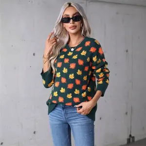 Trendy dark green round neck knit sweater featuring vibrant yellow and orange maple leaf patterns