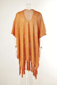 Front view of orange hollow knit beach cover-up with tassel hem on a clear mannequin