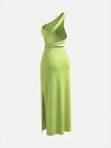 Back view of lime green one-shoulder cut-out maxi dress with high side slit