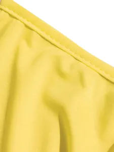 Macro detail of yellow stretch fabric with precise stitching for summer maxi dress