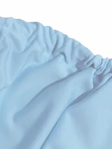 Macro detail of the light blue elasticated fabric for this summer two-piece dress set