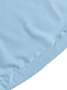 Macro detail of light blue fabric showing fine texture and neat stitching for women's dress.