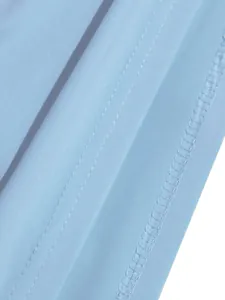 Close-up of the stitching and hem detail on the light blue summer dress fabric