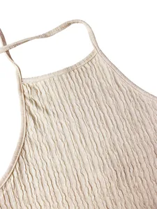 Close-up of beige halter top featuring elegant pleated textured fabric detail