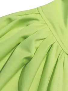 Detailed view of neon green pleated fabric texture on a sexy summer two-piece dress set