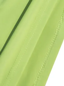 Close-up detail of high-quality stitching on lime green stretch fabric for women's dress.