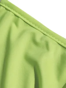 Detailed close-up of vibrant lime green ribbed fabric texture with clean stitched edge