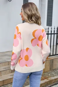 Back view of women's round neck knit sweater with large pink floral prints