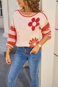 Detailed view of women's floral striped crew neck sweater with soft knit texture.