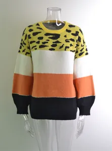 Front view of women's oversized leopard print patchwork crew neck knit sweater on mannequin