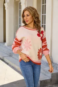 Detailed view of a casual floral knit sweater with striped sleeves and a classic crew neck.