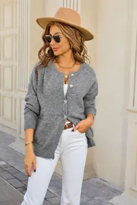 Stylish grey round-neck knit cardigan featuring button closure and front pockets detail