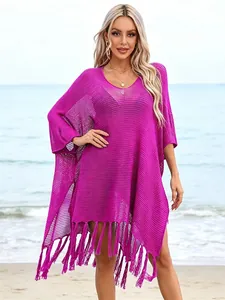 Vibrant purple hollow-out knit beach cover-up with stylish tassels for summer vacation