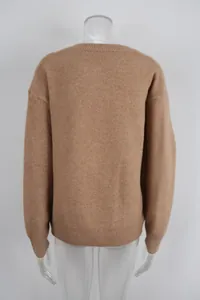 Detailed back view of a camel-colored oversized knitted crew neck sweater for women