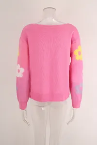 Back view of pink knitted sweater with floral embroidery on sleeves and boat neck.