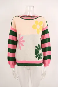 Detailed front view of colorful floral knit sweater with striped sleeves and crew neck.