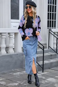 Stylish black sweater with large purple flower print paired with denim cargo skirt