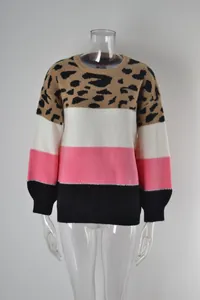 Detail of women's leopard print patchwork knit sweater with round neck in pink and black.