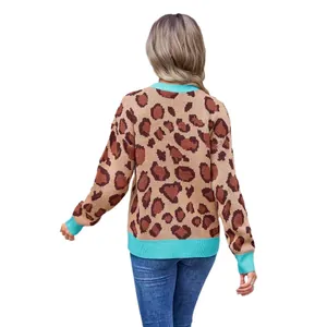 Back view of women's trendy leopard print knit sweater featuring blue contrast ribbed trim