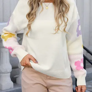 Oversized off-white boat neck knit sweater with colorful floral pattern on sleeves