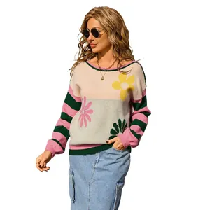 Fashionable patchwork crew neck sweater featuring large floral motifs and stripes