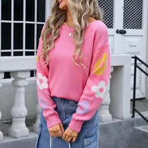 Cozy oversized pink knit sweater with floral embroidery on sleeves and boat neck