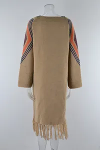 Back view of a long khaki knitted cardigan with orange geometric patterns and fringe hem