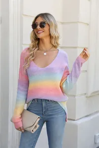 Detail view of a rainbow gradient V-neck knit sweater on a female model.