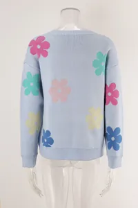 Detailed back view of light blue crew neck sweater with colorful flower patterns