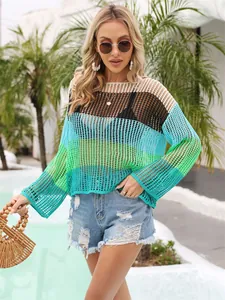 Detailed view of a vibrant rainbow color-block hollow-out knit cover-up for summer vacations.