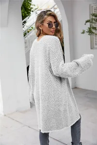 Back view of a stylish fuzzy grey chevron pattern long knit cardigan for women street style wear.