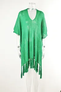 Detailed view of the green hollow-out crochet beach cover-up with stylish tassels