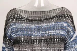 Close-up detail of hollow-out knit striped boat neck beach cover-up sun protection top.