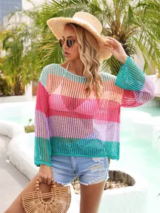 Beautiful lifestyle view of colorful rainbow striped crochet mesh cover-up for beach resort