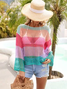 Detail of rainbow striped hollow-out crochet cover-up for summer beach vacation
