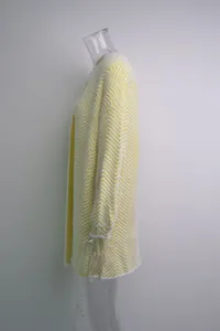 Side view of mid-length yellow and white chevron knit cardigan with soft fuzzy texture