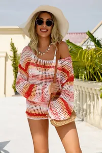 Detailed view of a vibrant hollow-out knit beach cover-up with colorful stripes.