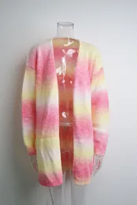 Detailed view of women's oversized rainbow tie-dye knit cardigan with pink and yellow gradient