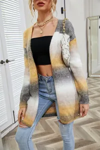 Close-up showing the soft gradient knit texture of the yellow and grey cardigan.