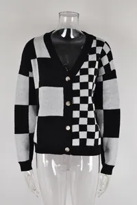 Front view of a women's black and grey checkerboard knitted cardigan on a mannequin