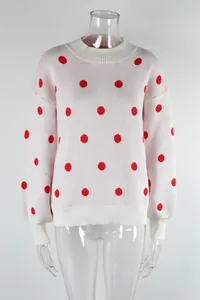 White knit sweater with classic red polka dot pattern and ribbed round neck